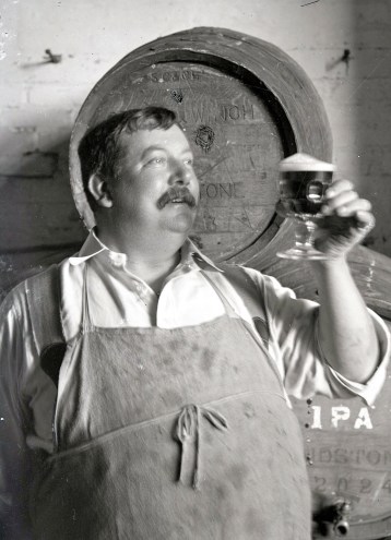 Brewer sampling beer