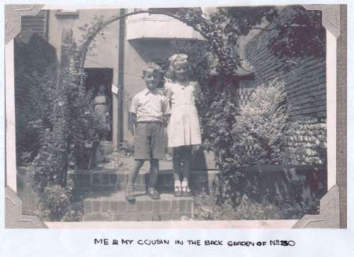 Peter Young and cousin in 30 Grange Road back garden, Lewes