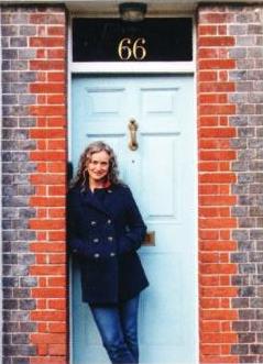 Carlotta Luke against door