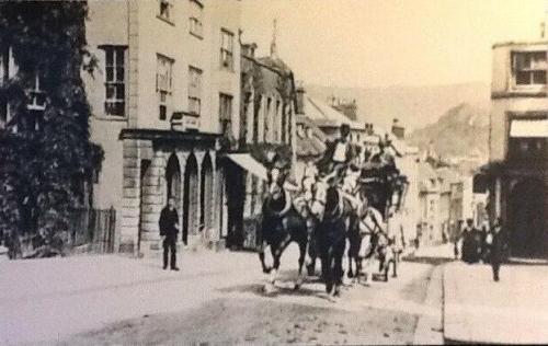 Coach and four ascending School Hill, Lewes, postcard